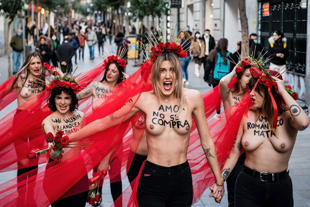 14 February 2022, Spain, Madrid: A group of feminist activists from the FEMEN movement demonstrate in the framework of Valentine's Day to denounce the latest homicides in Spain. Photo: Diego Radames/SOPA Images via ZUMA Press Wire/dpa.
