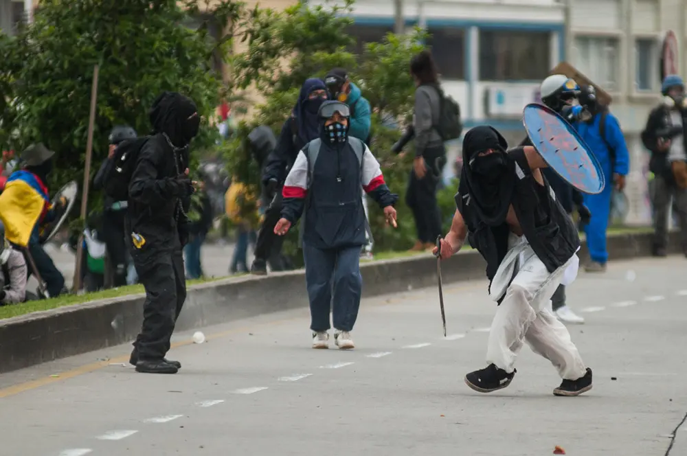 28 April 2022, Colombia, Bogota: Protesters clash with anti-riot police during a protest against the government of Colombian President Ivan Duque to mark the first anniversary of a social outbreak. Photo: Chepa Beltran/LongVisual via ZUMA Press Wire/dpa.