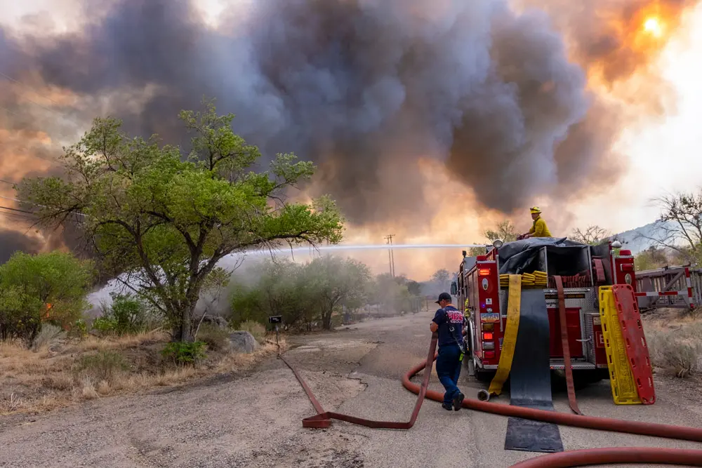 16 June 2022, US, Albuquerque: A crew from the Albuquerque Fire Rescue Department battle the Carnuel Brush fire. Photo: Adolphe Pierre-Louis/Albuquerque Journal via ZUMA/dpa.