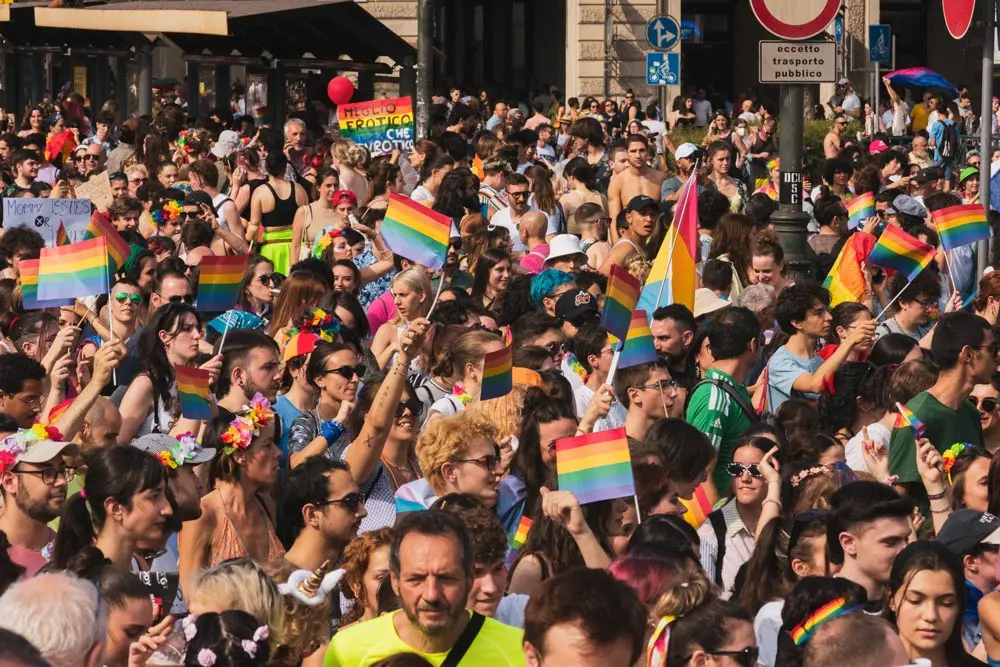 18 June 2022, Italy, Turin: People wave rainbow flags through the streets of Turin during the annual Pride parade. Photo: Matteo Secci/ZUMA Press Wire/dpa.