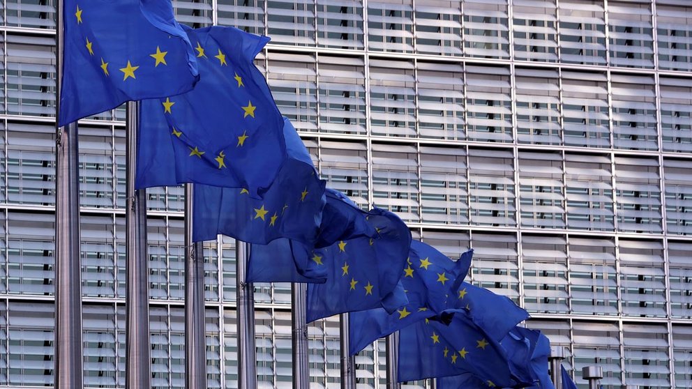 FILE PHOTO: European Union flags fly outside the European Commission headquarters in Brussels, Belgium, February 19, 2020. REUTERS/Yves Herman/File Photo