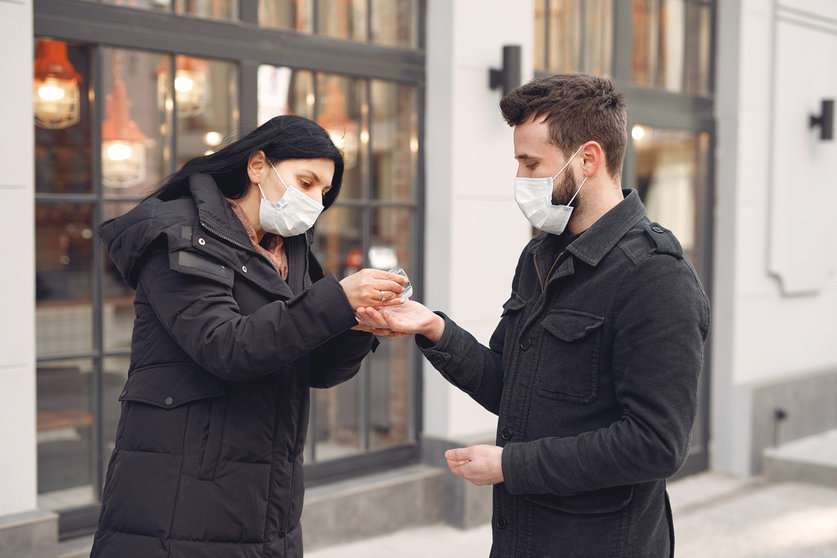 Woman-man-mask-couple-hand-sanitizer