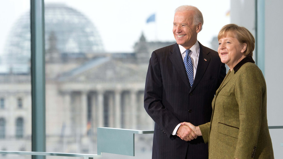 FILED - 01 February 2013, Berlin: German Chancellor Angela Merkel (R) shakes hands with then US Vice-President Joe Biden prior to their meeting. Merkel said Berlin&#39;s friendship with the US is vital if the problems of these times are to be overcome, as she congratulates Joe Biden on his victory in the US presidential election. Photo: picture alliance / dpa