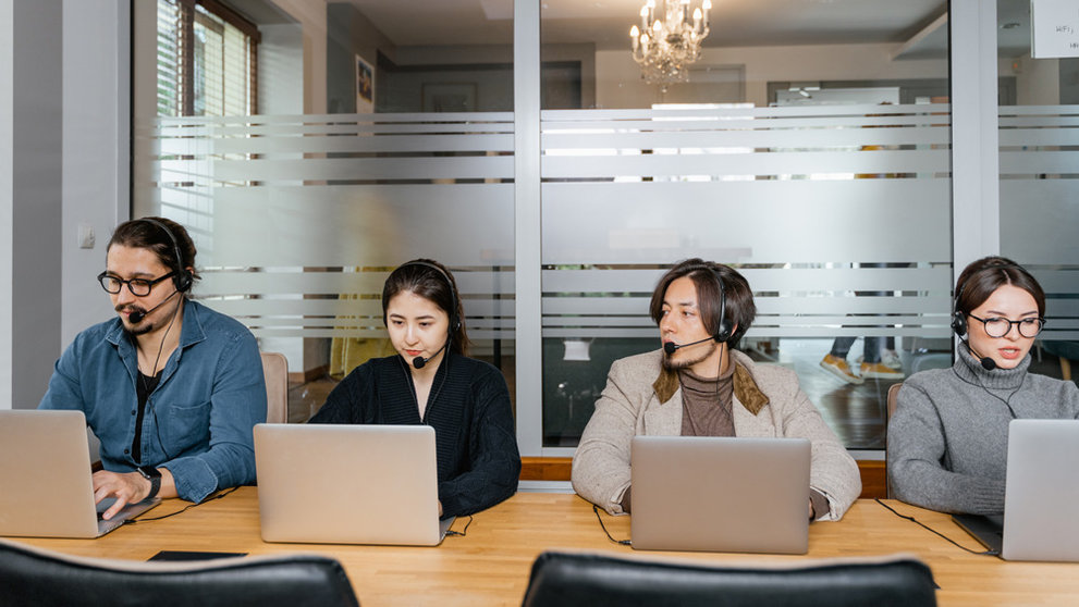 People working in an office. Photo: Pexels.