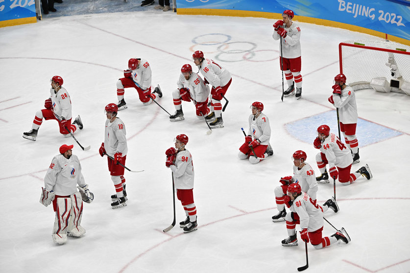 20 February 2022, China, Beijing: Russian Olympic Committee players react after losing the Men's Ice Hockey Gold medal match between Finland and Russian Olympic Committee at Beijing 2022 Winter Olympic Games. Photo: Peter Kneffel/dpa