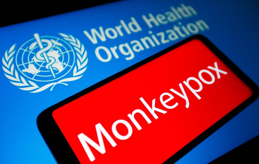 21 May 2022, Ukraine, ---: Monkeypox word is seen on the screen of a smartphone and the World Health Organization (WHO) logo in the background. Authorities in Australia, France and Germany confirmed their first cases of monkeypox on Friday as the normally rare disease continues to crop up in a growing number of countries around the globe. Photo: Pavlo Gonchar/SOPA Images via ZUMA Press Wire/dpa.