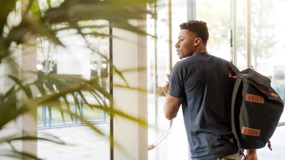 Student man black door