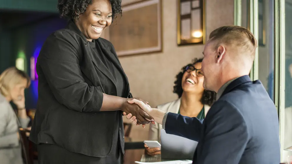 Black woman man job agreement hands