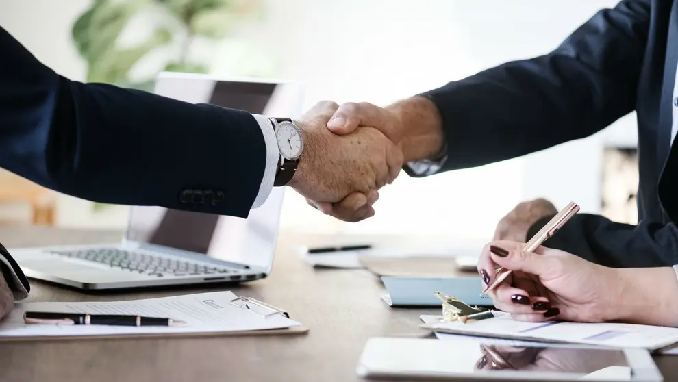 Business hands shaking agreement