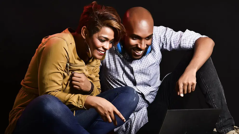 Couple man woman computer black smile