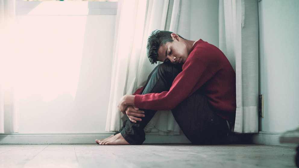 Depression-man-dark-sad-sitting-sad-by-Fernando-@cferdo-on-Unsplash