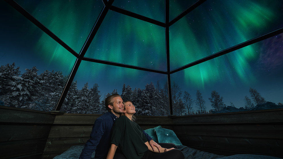 Northern-lights-in-Arctic-Snow-Hotel,-by-Visit-Rovaniemi