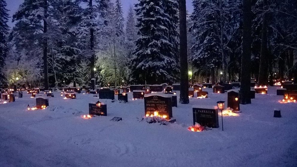 Candles-cemetery-Finland by Amanda Reed