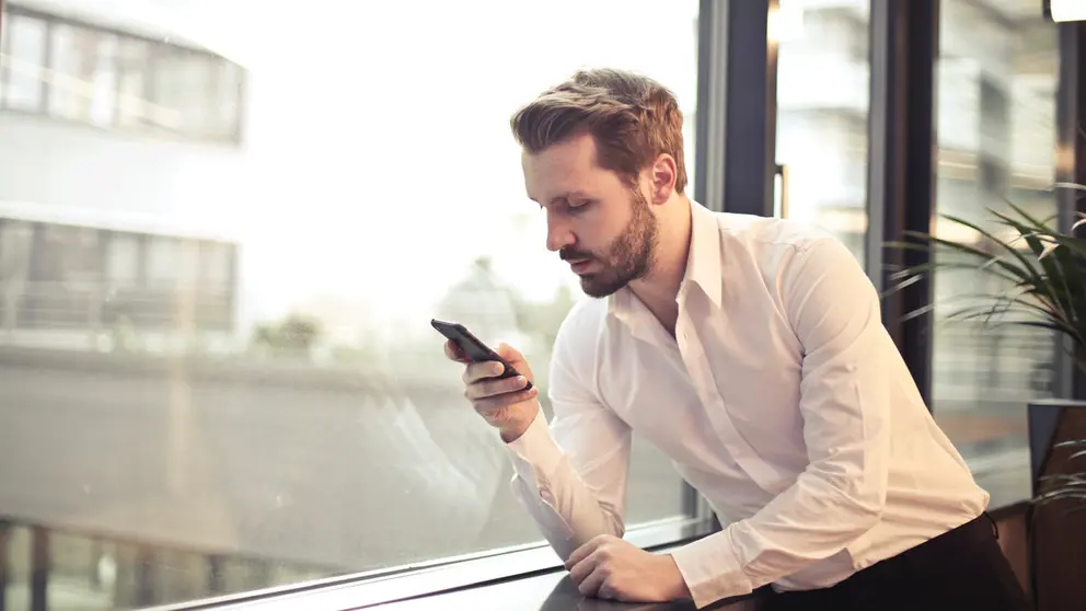 Man-white-shirt-mobile-smartphone