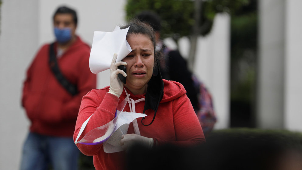A woman reacts after being informed that her relative passed away due to the coronavirus disease (COVID-19) at the Regional General Hospital No. 2 of the Mexican Institute of Social Security (IMSS), as the spread of the COVID-19 continues in Mexico City, Mexico May 7, 2020. REUTERS/Luis Cortes
