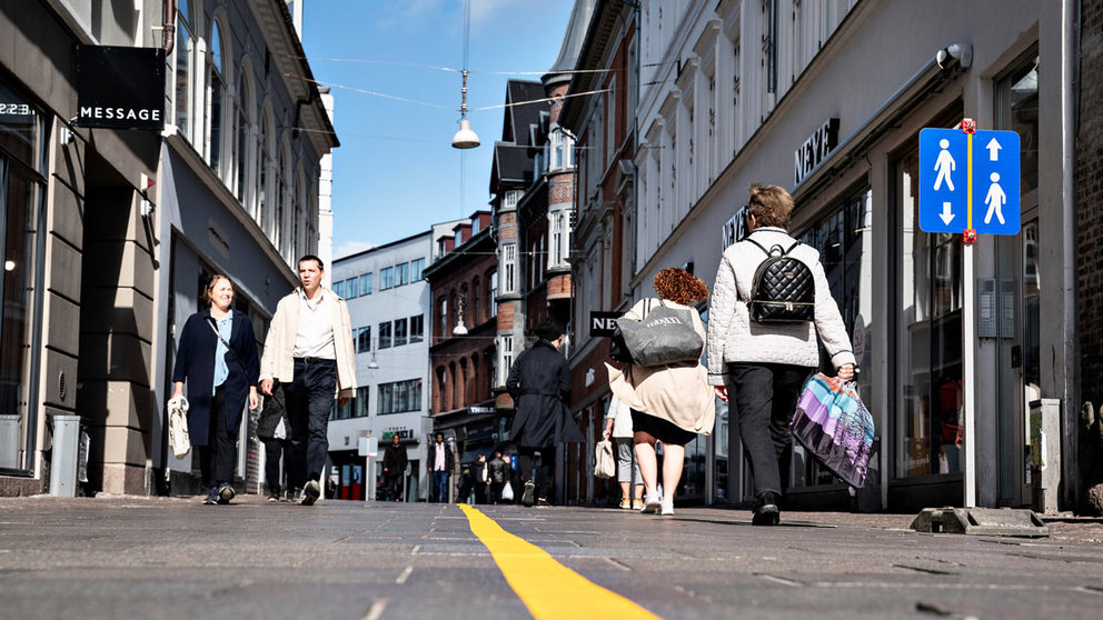 Yellow stripe is painted in the middle of a pedestrian street to help people comply with the social distance guidelines related to the coronavirus disease (COVID-19) situation in Aalborg, Denmark May 4, 2020. Henning Bagger/Ritzau Scanpix/via REUTERS