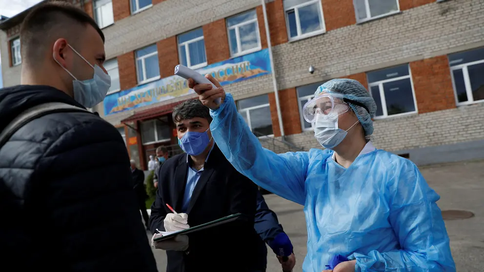 A Russian conscript gets his temperature checked at a recruiting station amid the coronavirus disease (COVID-19) outbreak in Kaliningrad, Russia May 20, 2020. REUTERS/Vitaly Nevar