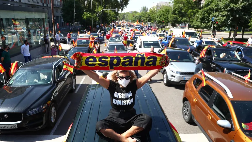 A supporter of Spain&#39;s far right party Vox attends a drive-in protest against the government&#39;s handling of the coronavirus disease (COVID-19) pandemic in Madrid, Spain, May 23, 2020. REUTERS/Sergio Perez