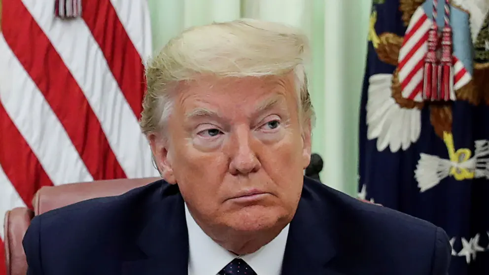 FILE PHOTO: U.S. President Donald Trump is seated prior to signing an executive order regarding social media companies in the Oval Office of the White House in Washington, U.S., May 28, 2020. REUTERS/Jonathan Ernst/File Photo