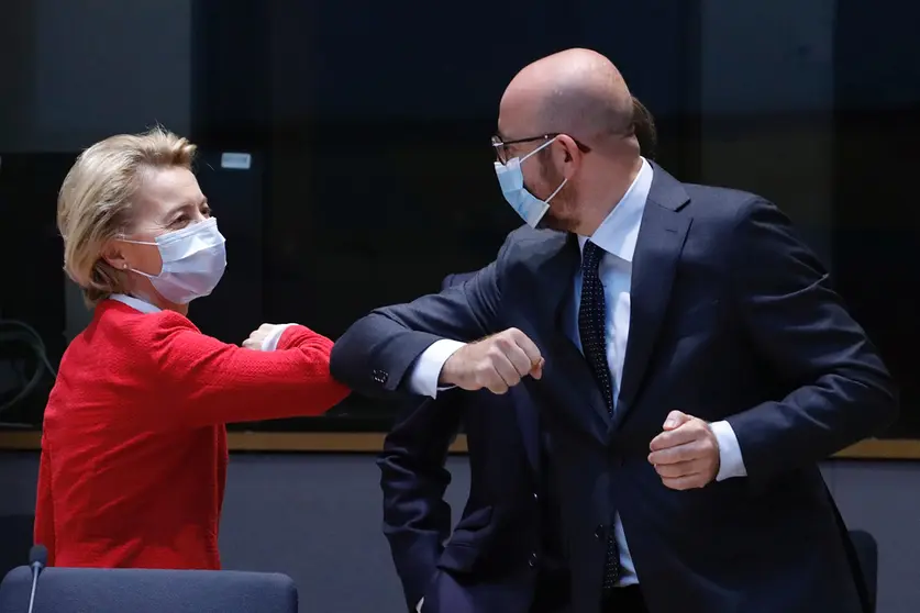 President of the European Council Charles Michel (R) and European Commission President Ursula von der Leyen, greet each other with an elbow during the European Council special summit. Photo: Dario Pignatelli/European Council/dpa.