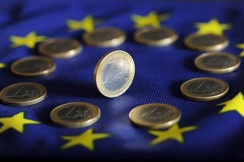 FILED - 04 July 2011, Baden-Wuerttemberg, Karlsruhe: Euro coins lie on a Euro flag. The rate of inflation in the 19 countries of the eurozone recuperated slightly to 0.4 per cent in July, according to a first estimate from EU statistical office Eurostat. Photo:Uli Deck/dpa.