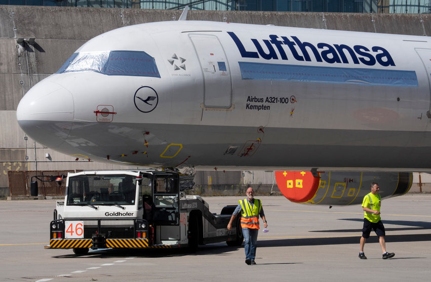 30 July 2020, Hessen, Frankfurt_Main: A Lufthansa passenger aircraft is towed to the airline&#39;s technical hangar at Frankfurt Airport as Lufthansa started reactivating some of its aircraft that were laid off during the peak of the coronavirus pandemic. Photo: Boris Roessler/dpa