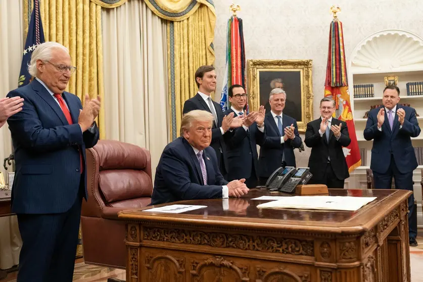 HANDOUT - 13 August 2020, US, Washington: US President Donald Trump, joined by White House senior staff members, as he delivers a statement in the Oval Office of the White House to announce that the United Arab Emirates and Israel have agreed to establish full diplomatic ties. Photo: Joyce N. Boghosian/dpa.