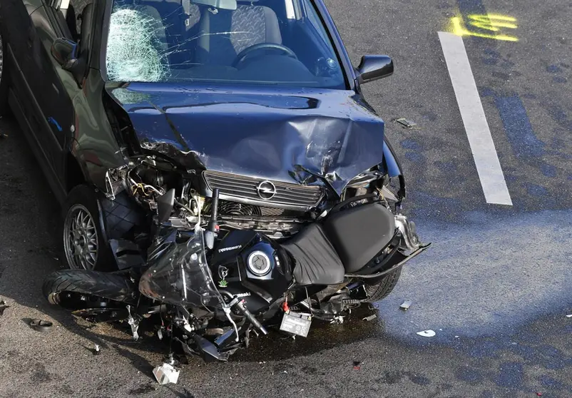 19 August 2020, Berlin: A broken car and a destroyed motorcycle stand on the Berlin A100 urban motorway after the car which carrying an alleged ammunition box made an accident at the Alboinstrasse exit. Photo: Paul Zinken/dpa.