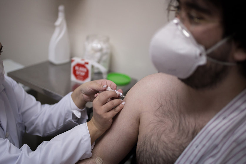 30 July 2020, Brazil, Sao Paulo: A volunteer at the Emilio Ribas Institute for Infectiology receives a newly developed coronavirus vaccine as part of its third testing phase by Chinese pharmaceutical company Sinovac. Photo: Andre Lucas/dpa.