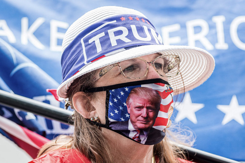 24 August 2020, US, Charlotte: A supporter of the US President Donald Trump takes part in rally during the opening day of the Republican National Convention. Photo: Sean Meyers/dpa.