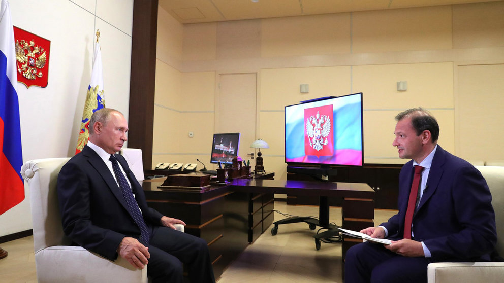 HANDOUT - 27 August 2020, Russia, Moscow: Russian President Vladimir Putin (L) speaks during a TV interview. Photo: -/Kremlin/dpa.