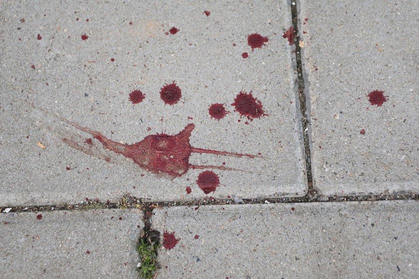 13 September 2020, North Rhine-Westphalia, Stolberg: Bloodstains seen on a sidewalk after a possibly Islamist-motivated stabbing attack against a car driver in Stolberg. German police on Sunday detained a man suspected of stabbing the driver of a car in Stolberg, near the western city of Aachen, in what is being treated as a possible Islamist attack. Photo: David Young/dpa.