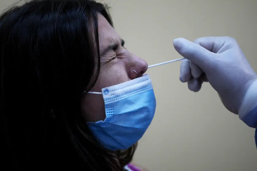 21 September 2020, Greece, Athens: A medic takes a swab sample from a teacher during a coronavirus testing campaign. Photo: Aristidis Vafeiadakis/dpa.