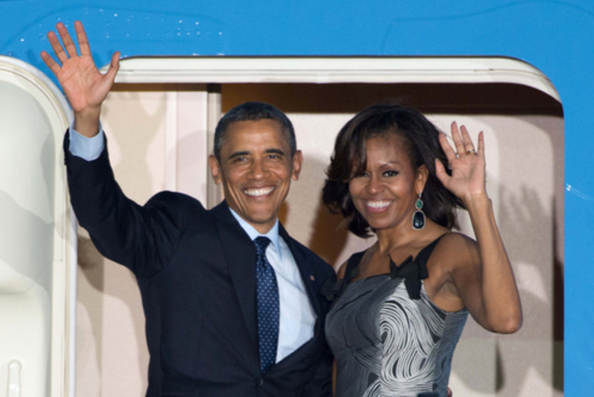 Barack Obama and his wife Michelle wave goodbye as they leave from Berlin, in 2013. Photo: Maurizio Gambarini/dpa/File Photo.