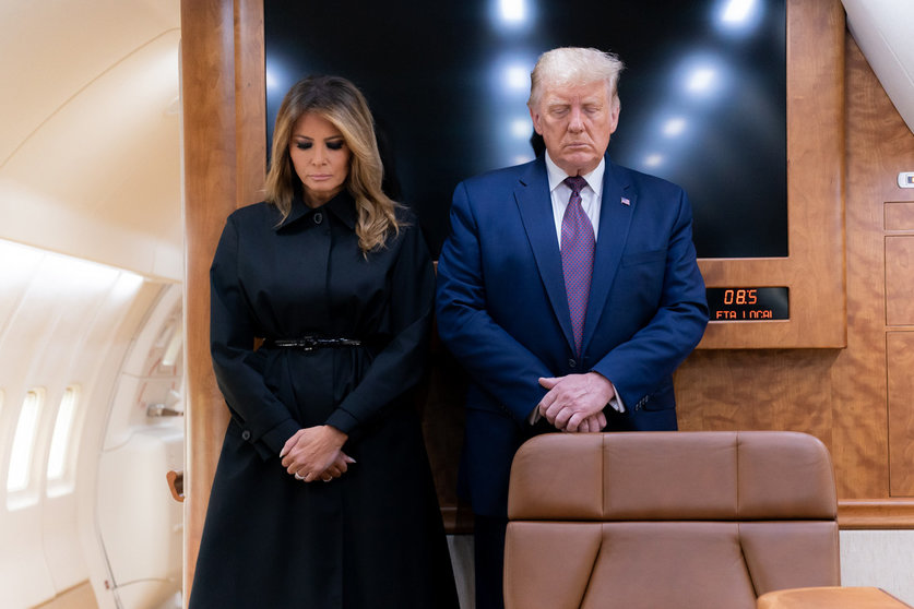HANDOUT - 11 September 2020, US, Pennsylvania: US President Donald Trump (R) and First Lady Melania Trump bow their heads during a moment of silence aboard Air Force One to mark the 19th anniversary of the 9/11 terrorist attacks on the World Trade Center. Photo: Shealah Craighead/White House.