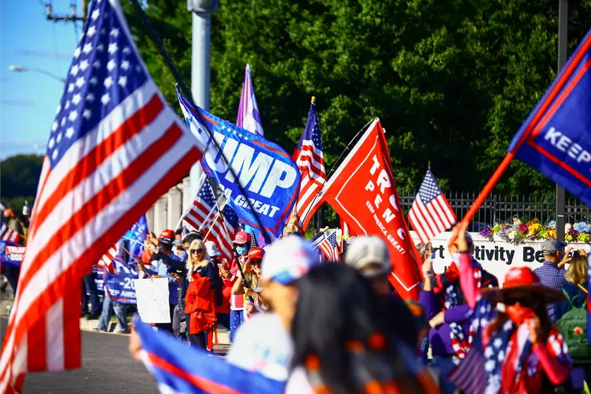 03 October 2020, US, Bethesda: Supporters of US President Donald Trump gather in front of the Walter Reed Military Hospital in Bethesda, where Trump is being treated after a coronavirus infection. Photo: Steven Ramaherison/dpa.