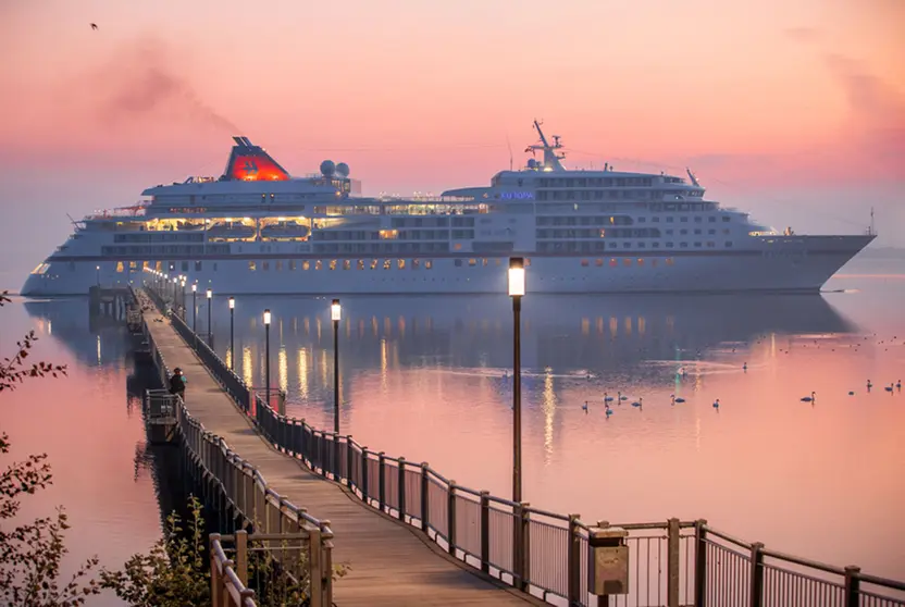 FILED - The cruise liner &#34;Europa&#34; passes the pier in Wismar-Wendorf in the early morning on its way to the harbour. In its latest effort to put some wind in the sails of a tourism sector left high and dry by the coronavirus pandemic, Singapore will from next month permit cruise ships to sail, for the first time since March. Photo: Jens Büttner/dpa.