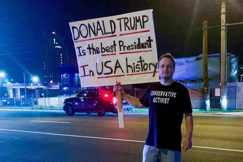 04 October 2020, US, Bethesda: A supporter of US President Donald Trump, holds a placards out side the Walter Reed Military Hospital in Bethesda, where Trump is being treated after a coronavirus (COVID-19) infection. Photo: Can Merey/dpa.