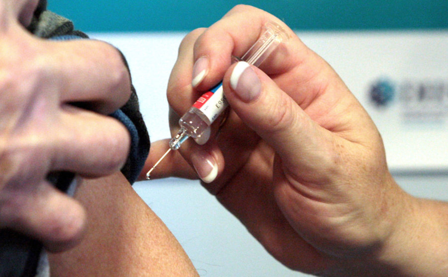 File photo dated 05/10/09 of a person receiving a vaccination. Photo: David Cheskin/dpa.