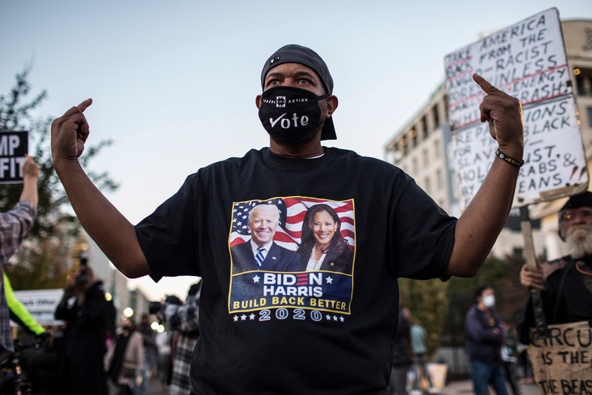 04 November 2020, US, Washington: A Biden&#39;s supporter posses for photograph during a Black Lives Matter protest near the White House while waiting for the final result of the 2020 Presidential election. Photo: Probal Rashid/dpa.