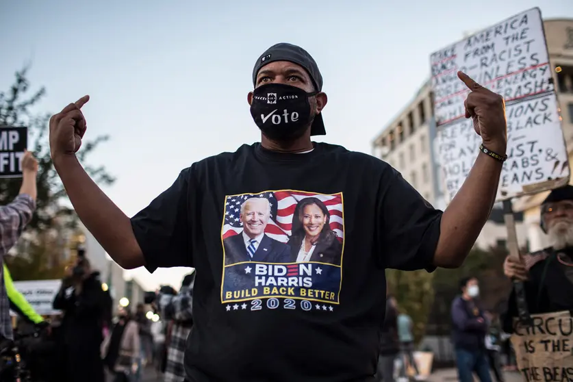 04 November 2020, US, Washington: A Biden&#39;s supporter posses for photograph during a Black Lives Matter protest near the White House while waiting for the final result of the 2020 Presidential election. Photo: Probal Rashid/dpa.