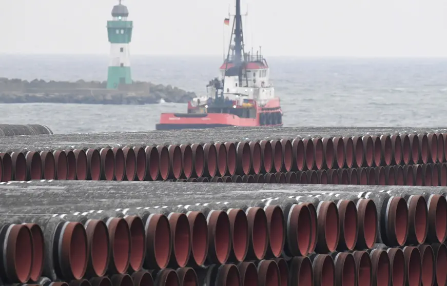 04 December 2020, Mecklenburg-Western Pomerania, Sassnitz-Mukran: Pipes of the Nord Stream 2 Baltic Sea gas pipeline are seen stored on the premises of the Mukran Port near Sassnitz. The Mukran Port on Ruegen Island is considered the most important transhipment point for the construction of the pipeline. Photo: Stefan Sauer/dpa-Zentralbild/dpa