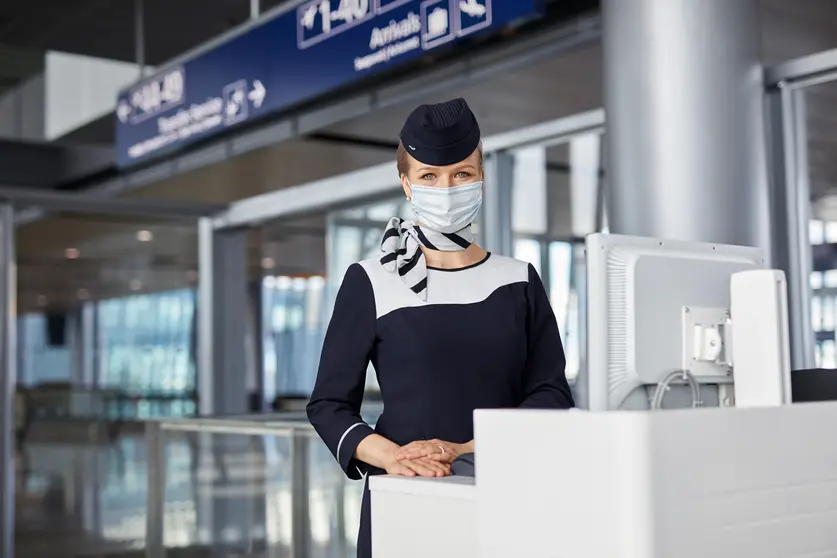 Finnair Airport Stewardess cabin crew at Gate 3 by Finnair.