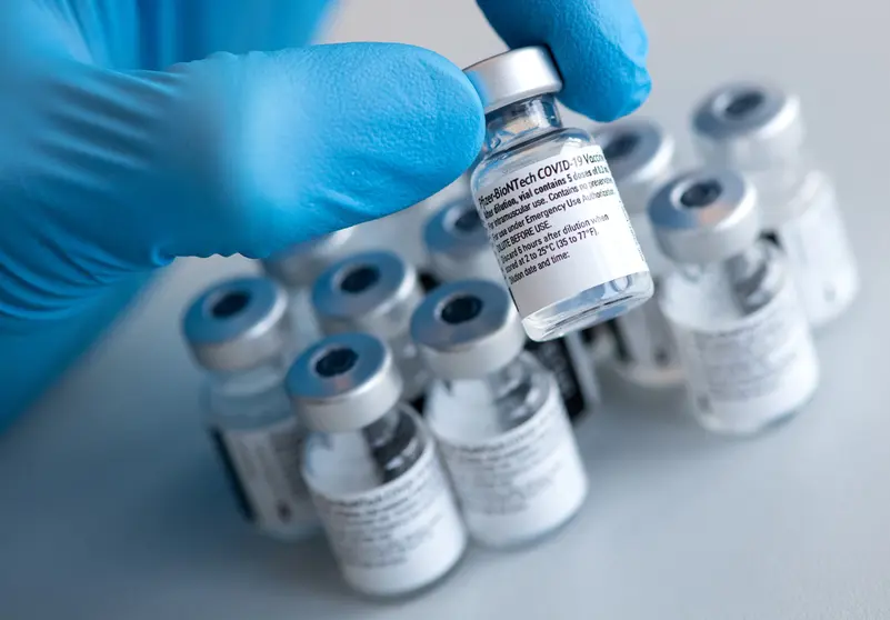 FILED - 10 January 2021, Bavaria, Pfaffenhofen a.d.Ilm: A health worker holds a Biontech and Pfizer coronavirus (Covid-19) vaccine vial during a vaccination campaign. German vaccine developer BioNTech pledged early Monday to ramp up its deliveries to the European Union by up to 75 million additional doses in the second quarter, amid huge pressure on Germany and other countries to speed up vaccinations. Photo: Sven Hoppe/dpa/dpa-tmn