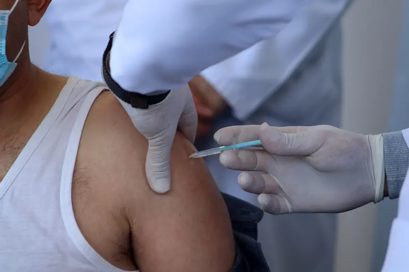 02 February 2021, Palestinian Territories, Bethlehem: A Palestinian health worker receives a Moderna Coronavirus (Covid-19) vaccine. Palestinian Authority began vaccinating health workers after a global pressure campaign on Israel to provide the vaccines. Photo: Mosab Shawer/APA Images via ZUMA Wire/dpa