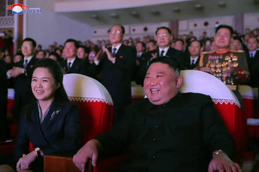 16 February 2021, North Korea, Pyongyang: A photo released by the Korean Central News Agency shows North Korean Leader Kim Jong-un (R) and his wife Ri Sol Ju watching a performance at the Mansudae Art Theater to mark the birthday of Kim's father, Kim Jong Il, who died in 2011, state media reported Wednesday. Kim's wife, Ri Sol Ju, has appeared in public for the first time in more than a year. Photo: -/YNA/dpa