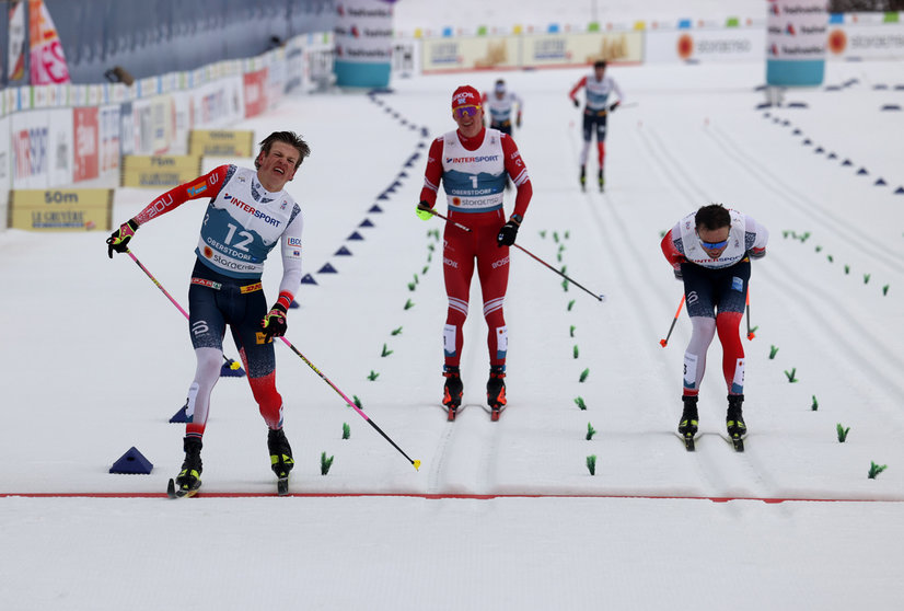07 March 2021, Bavaria, Oberstdorf: Johannes Hoesflot Klaebo of Norway (L) crosses the finish line ahead of Emil Iversen of Norway (R) and Alexander Bolshunov from Russia during the men's 50 kilometre classical mass start event at the FIS Nordic World Ski Championships in Oberstdorf. Photo: Karl-Josef Hildenbrand/dpa