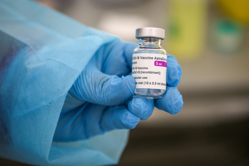 06 March 2021, France, Marseille: A health worker holds a vial of the AstraZeneca COVID-19 vaccine during a mass vaccination. Photo: Denis Thaust/SOPA Images via ZUMA Wire/dpa