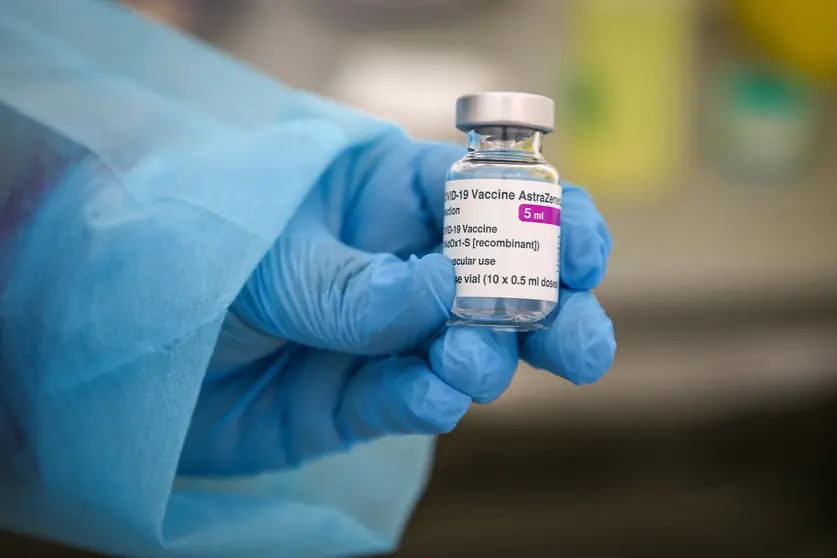 06 March 2021, France, Marseille: A health worker holds a vial of the AstraZeneca COVID-19 vaccine during a mass vaccination. Photo: Denis Thaust/SOPA Images via ZUMA Wire/dpa