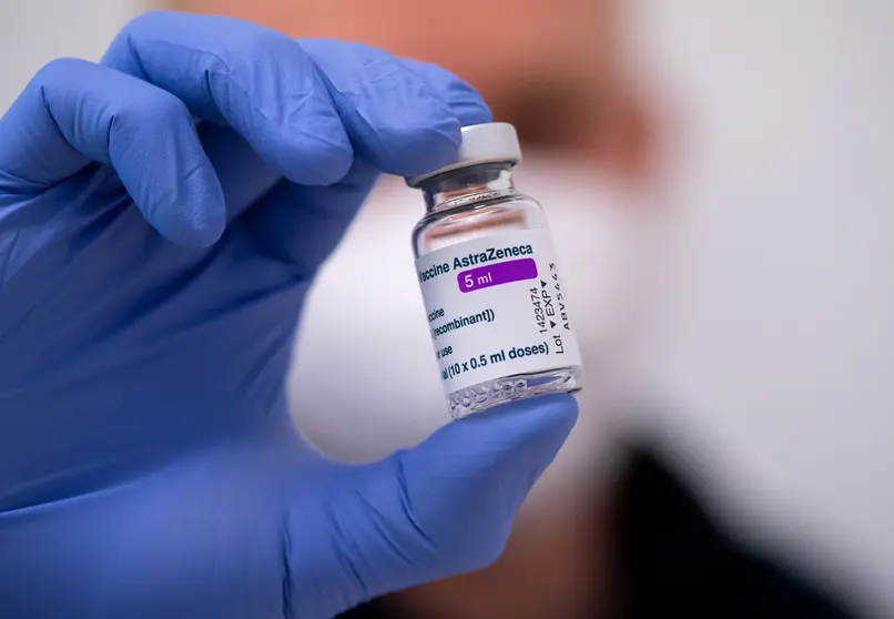 FILED - 02 March 2021, Bavaria, Munich: An employee holds a vial of AstraZeneca's Corona vaccine at the police vaccination center in Munich. Germany, France and Italy on Monday became the latest countries to temporarily suspend use of the Covid-19 vaccine developed by AstraZeneca over blood clot concerns, joining others in Europe including Ireland, Denmark, Norway and the Netherlands. Photo: Sven Hoppe/dpa